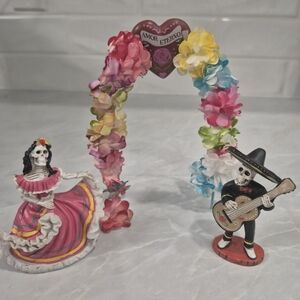 Festive Skeleton Couple with Floral Arch